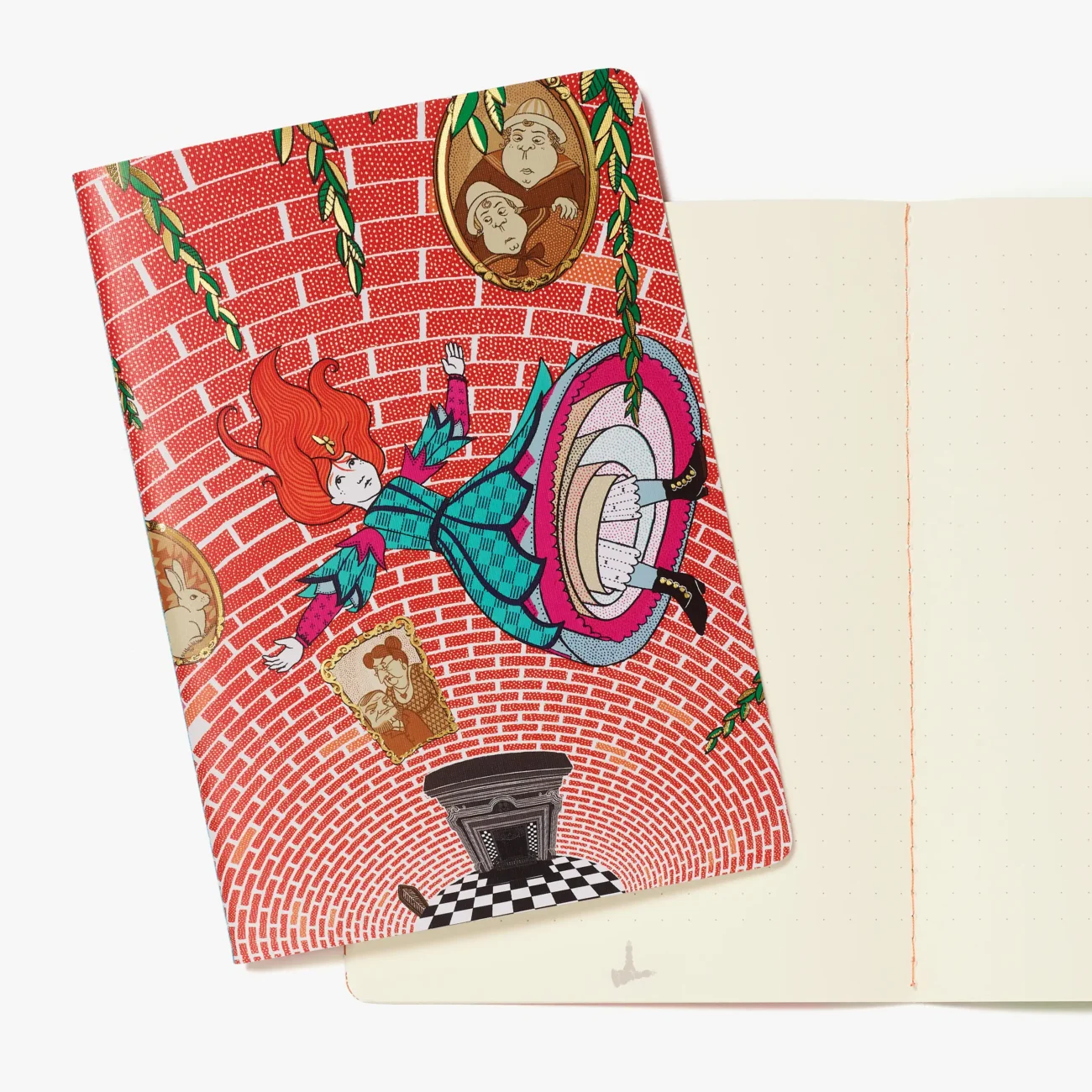 Alice falling down the rabbit hole design notebook with view of open notebook with stitch binding and dotted pages.