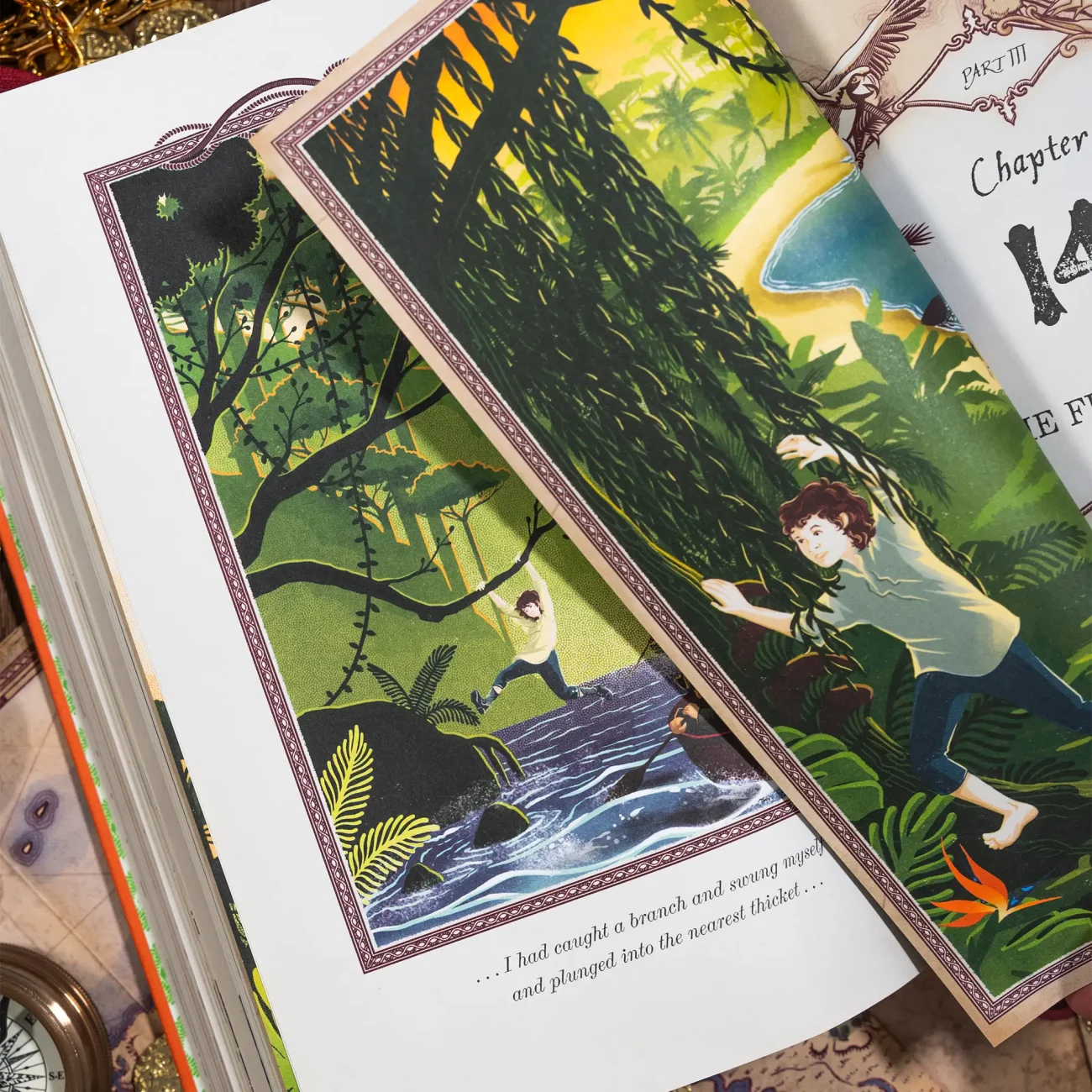 Treasure Island by Robert Louis Stevenson deluxe edition illustrated by MinaLima (book open showing illustrations)