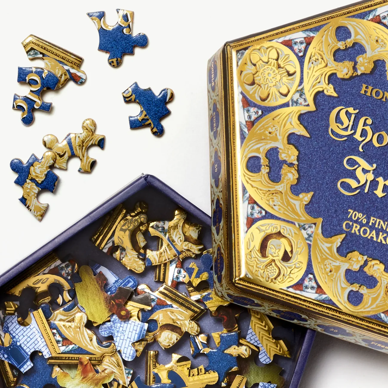 Honeydukes Chocolate Frog double-sided 50-piece Harry Potter jigsaw puzzle (close-up view with pieces in box)